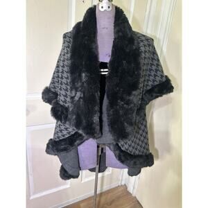 Shaw wrap sleevless but top layer covers arms. Faux fur trim lining. One size